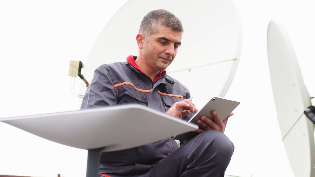 Man installing Sarlink equipment - GoBrolly